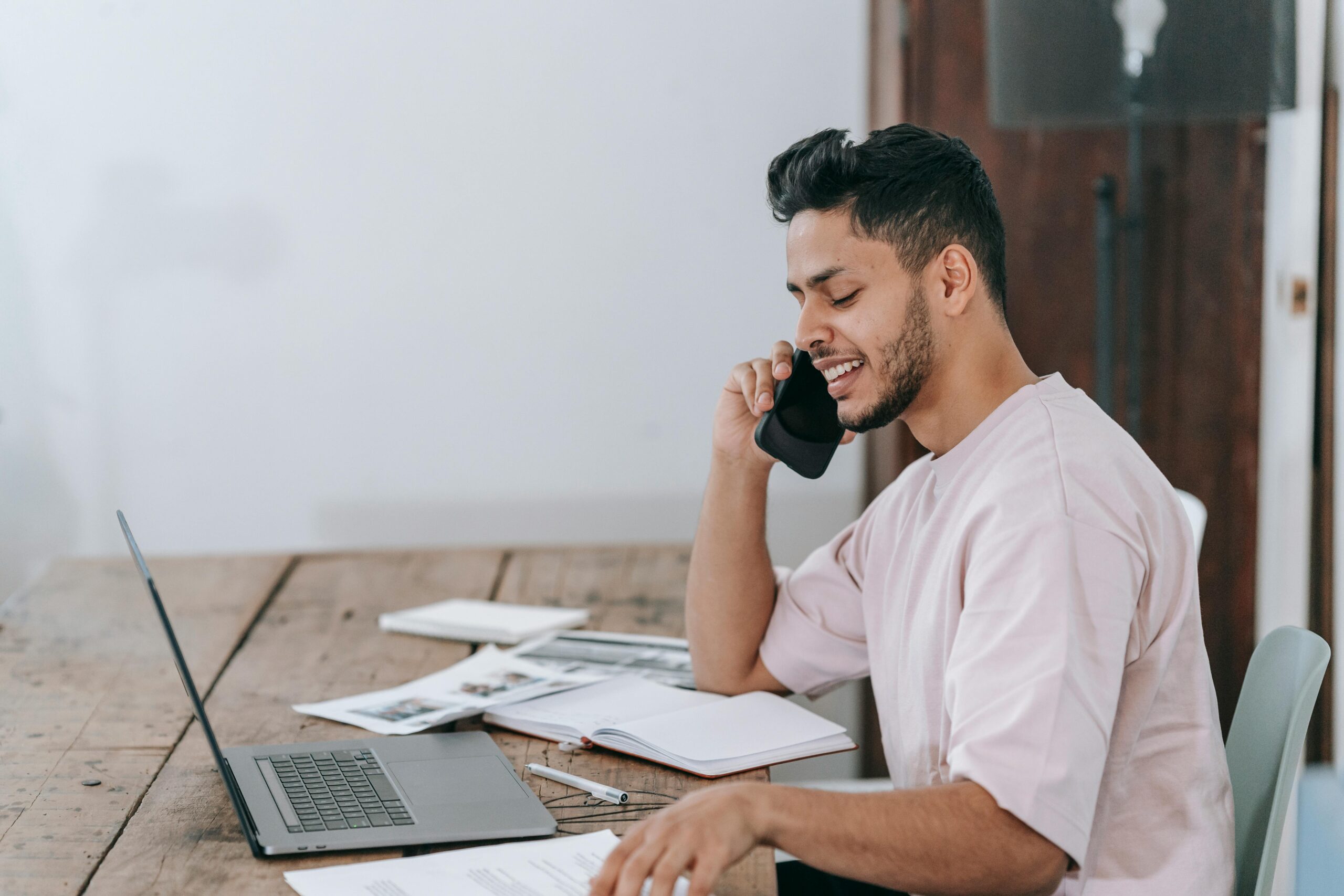 A self-employed in a phone call and doing some admin tasks